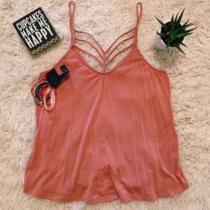 Express coral tank top with bracelets